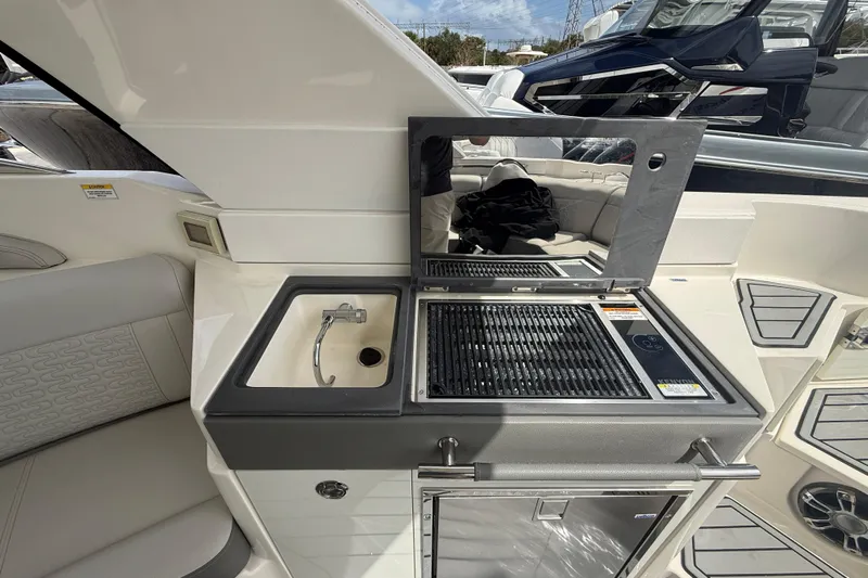  Yacht Photos Pics 2020 Sea Ray SLX 350 Outboard boat interior with sink and grill station.