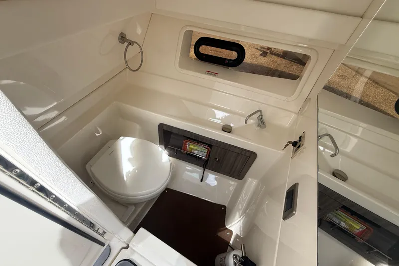  Yacht Photos Pics 2020 Sea Ray SLX 350 Outboard bathroom with toilet, sink, and window.