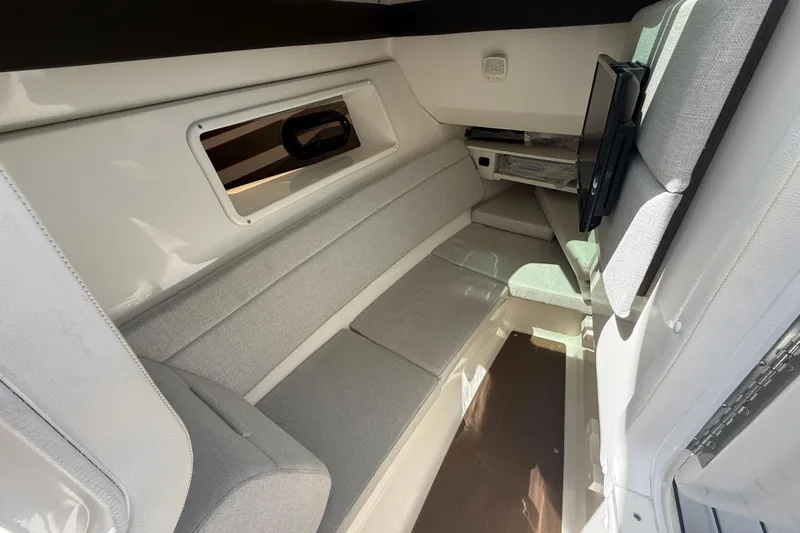  Yacht Photos Pics Interior cabin of 2020 Sea Ray SLX 350 Outboard with gray seating and window.