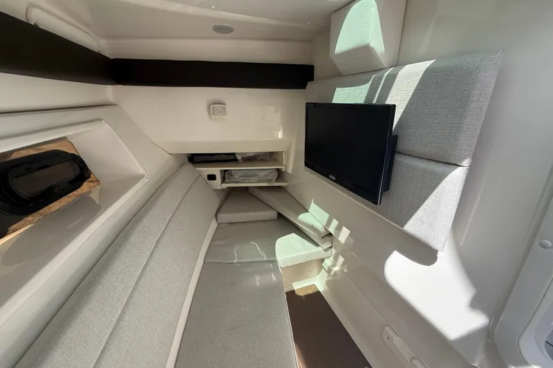  Yacht Photos Pics 2020 Sea Ray SLX 350 Outboard cabin interior with seating and mounted TV.