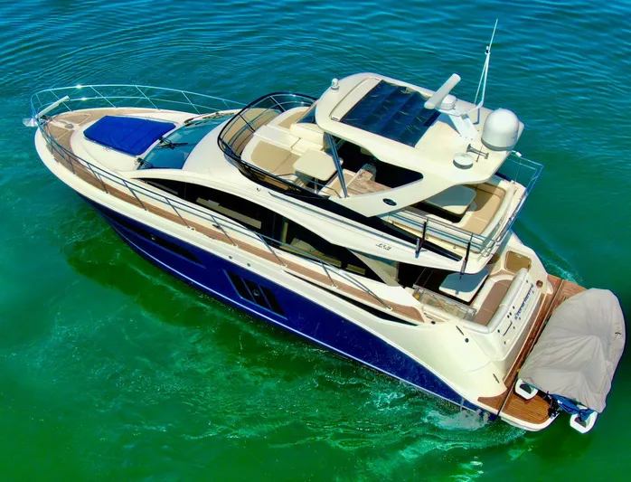  Yacht Photos Pics 2015 Sea Ray 510 Fly yacht on clear turquoise water, aerial view.