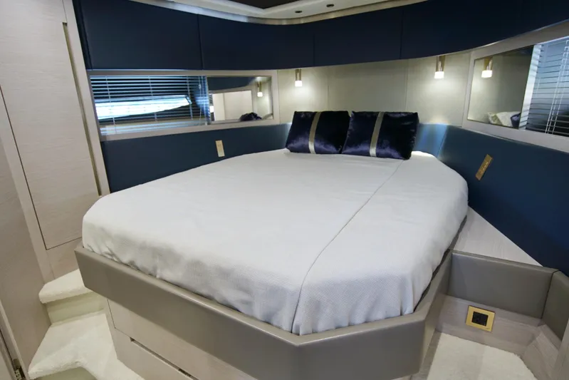  Yacht Photos Pics Luxurious bedroom interior of 2024 Uniesse HTC5P yacht with modern design elements.