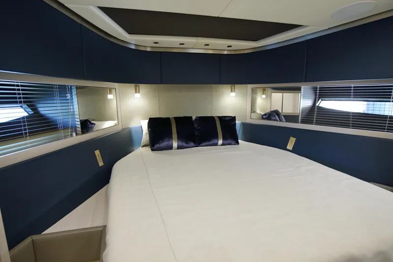  Yacht Photos Pics Luxurious 2024 Uniesse HTC5P yacht bedroom with modern design and elegant lighting.