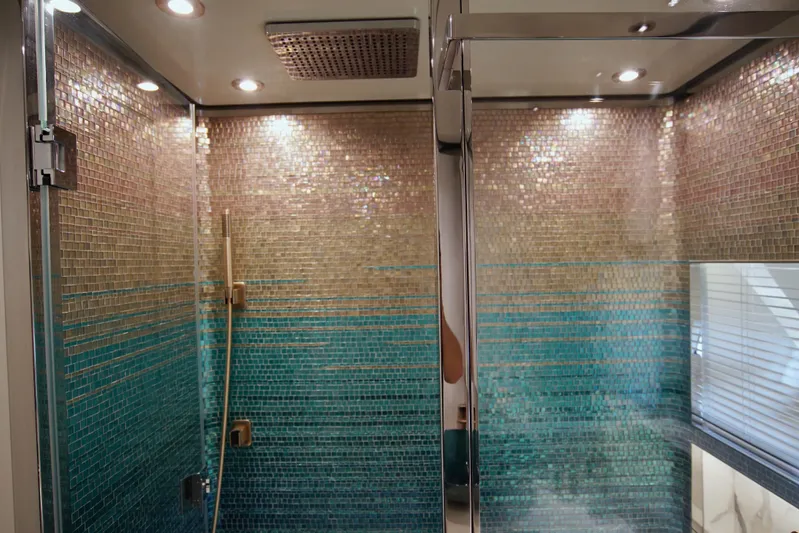  Yacht Photos Pics Luxurious shower with mosaic tiles in 2024 Uniesse HTC5P yacht bathroom.