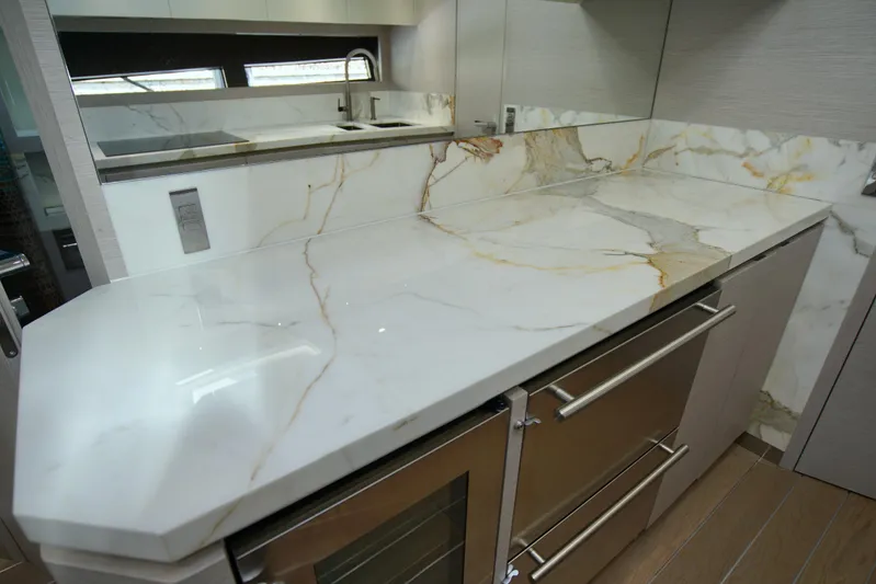  Yacht Photos Pics Luxurious marble countertop in 2024 Uniesse HTC5P yacht kitchen interior.