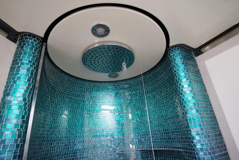  Yacht Photos Pics Luxurious shower with turquoise mosaic tiles in 2024 Uniesse HTC5P yacht.