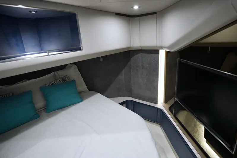  Yacht Photos Pics Luxurious 2024 Uniesse HTC5P yacht cabin with modern design and cozy bedding.