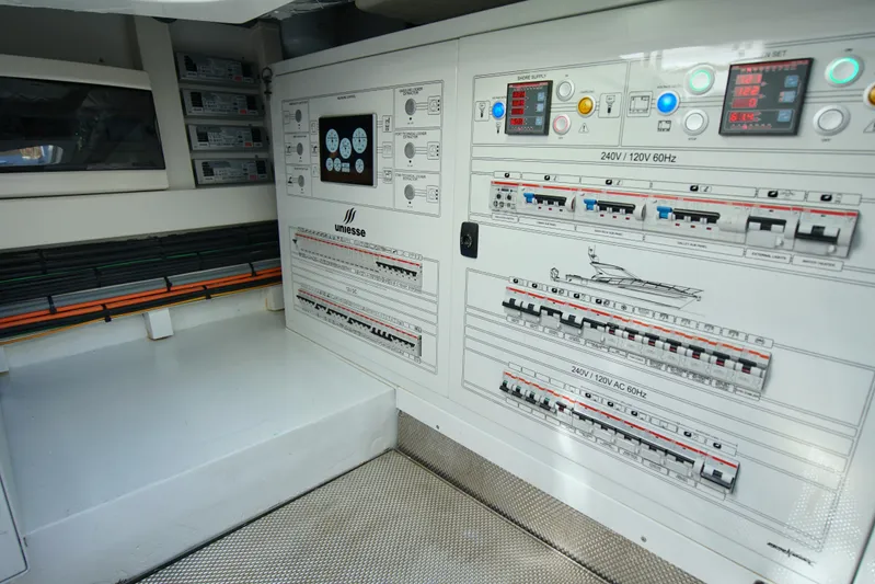  Yacht Photos Pics Electrical control panel of 2024 Uniesse HTC5P yacht, featuring switches and displays.