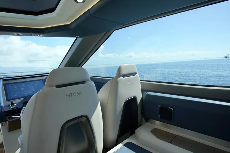  Yacht Photos Pics Interior view of 2024 Uniesse HTC5P yacht with ocean backdrop.