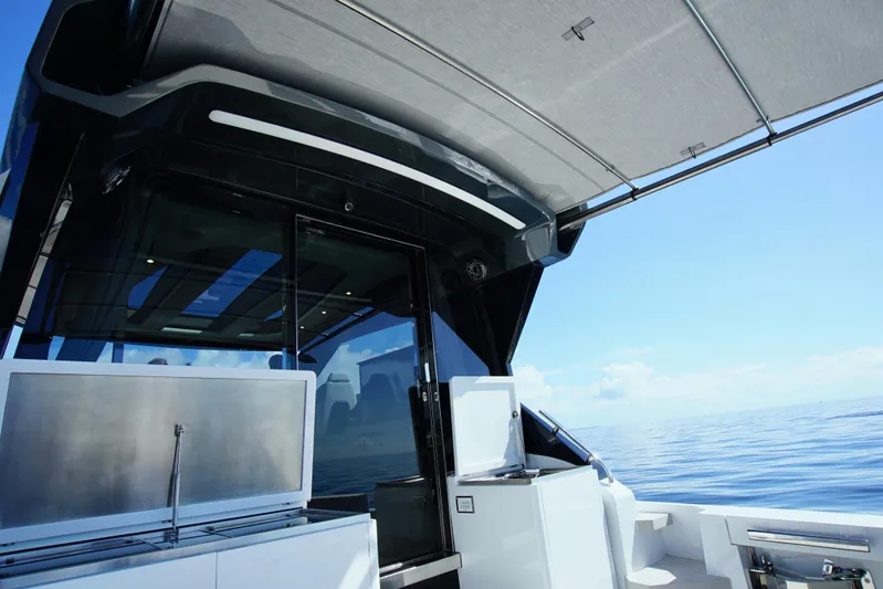  Yacht Photos Pics 2024 Uniesse HTC5P yacht deck with sleek design and ocean view.