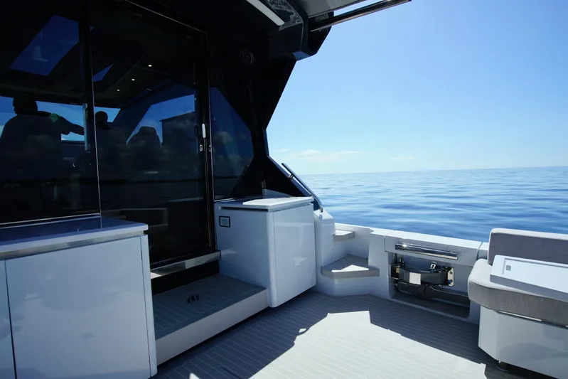  Yacht Photos Pics 2024 Uniesse HTC5P yacht deck with sleek design and ocean view.