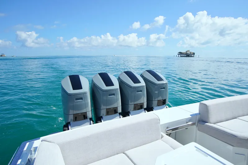  Yacht Photos Pics 2024 Uniesse HTC5P boat with four engines on a calm ocean.