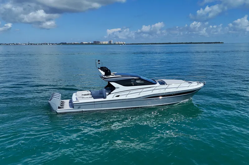  Yacht Photos Pics 2024 Uniesse HTC5P yacht cruising on clear blue ocean waters.