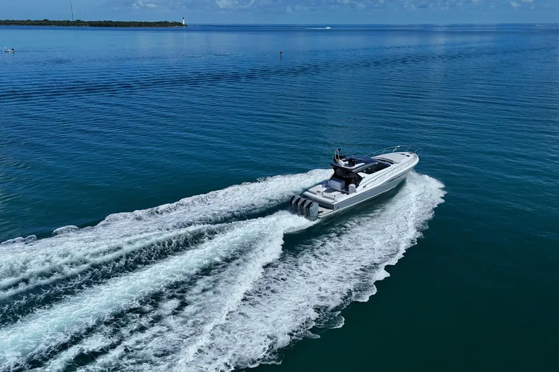  Yacht Photos Pics 2024 Uniesse HTC5P luxury yacht cruising on open blue water.