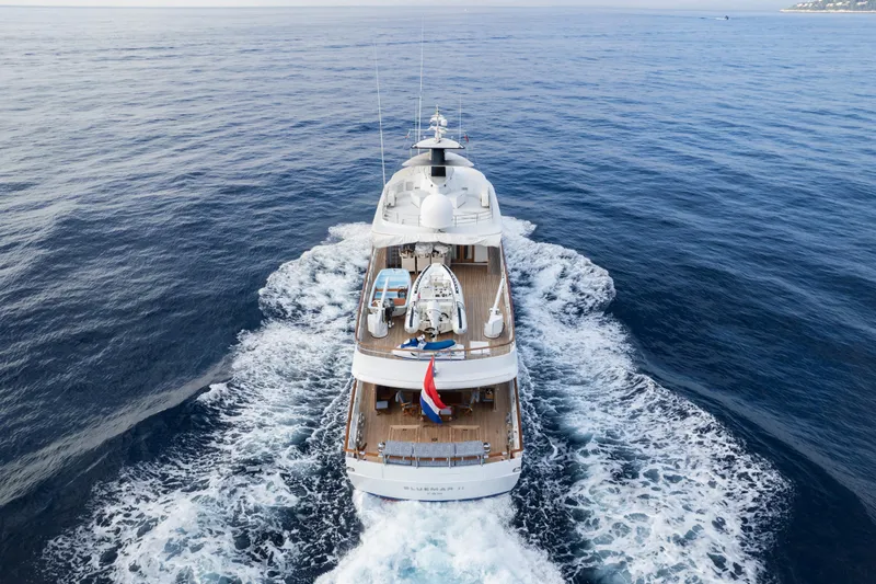 Bluemar II Yacht Photos Pics Aerial view of 1978 Feadship Classic yacht cruising on open water.