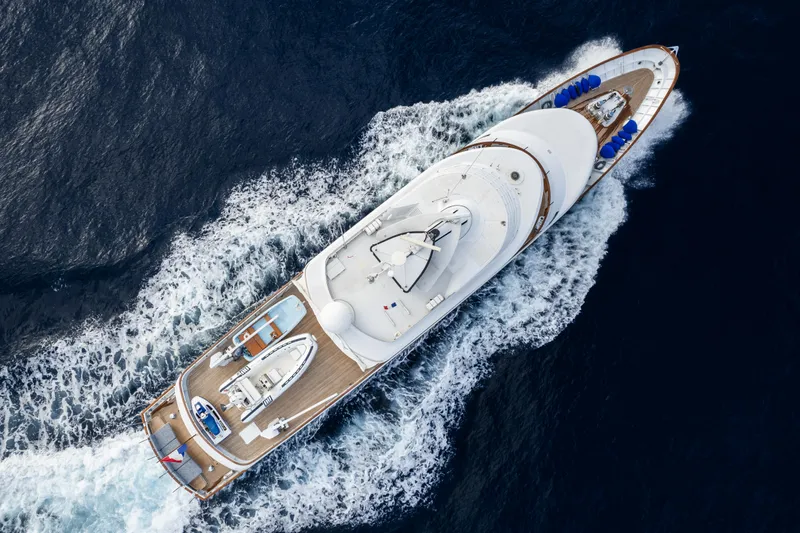 Bluemar II Yacht Photos Pics Aerial view of 1978 Feadship Classic yacht cruising on the ocean.
