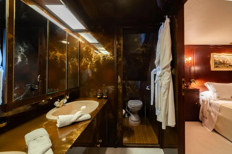 Bluemar II Yacht Photos Pics Luxurious bathroom on a 1978 Feadship Classic yacht with elegant decor and amenities.