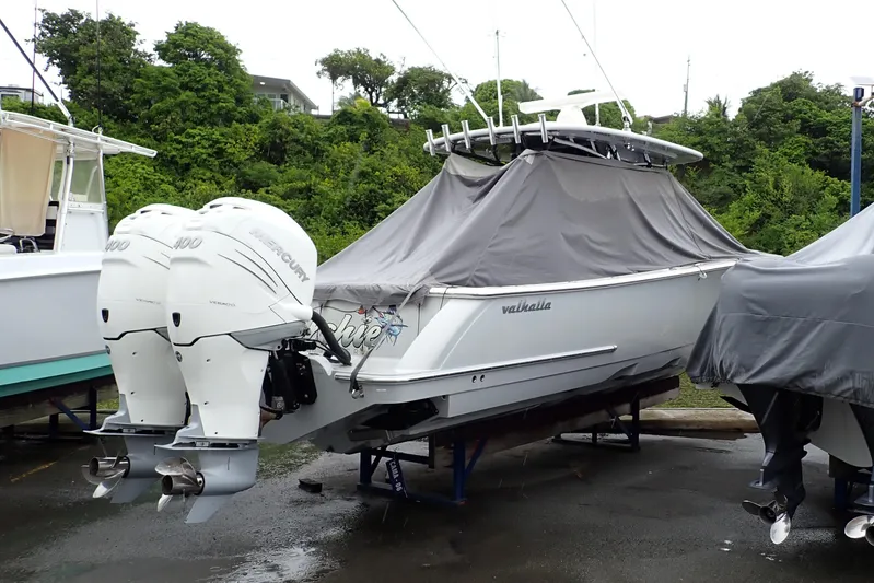 Archie Yacht Photos Pics 2021 Valhalla Boatworks V-33 with twin Mercury engines, covered and docked outdoors.
