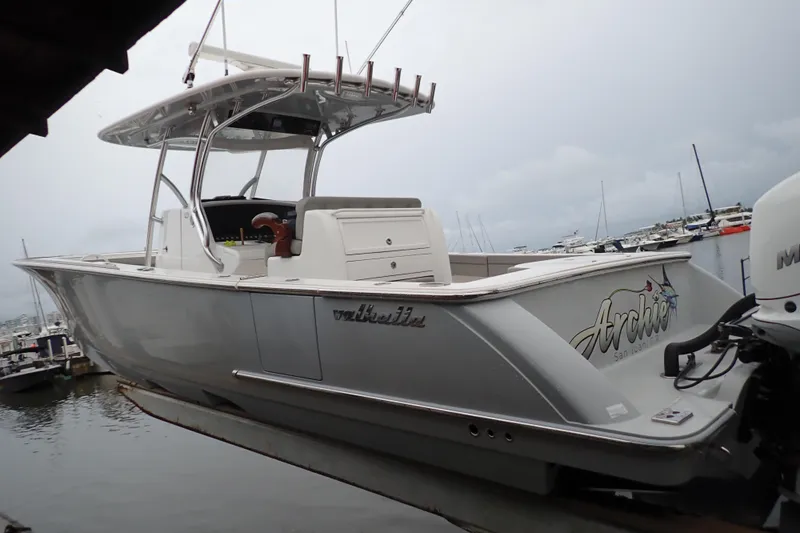 Archie Yacht Photos Pics 2021 Valhalla Boatworks V-33 in marina, side view with overcast sky.