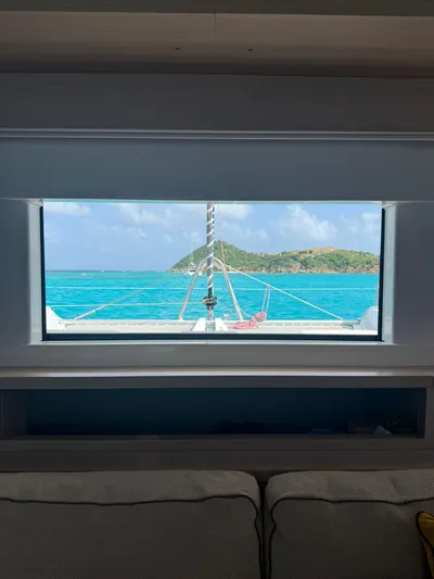 Jdmontt Yacht Photos Pics View from Lagoon 55 yacht window, turquoise sea, island in distance, 2024 model.