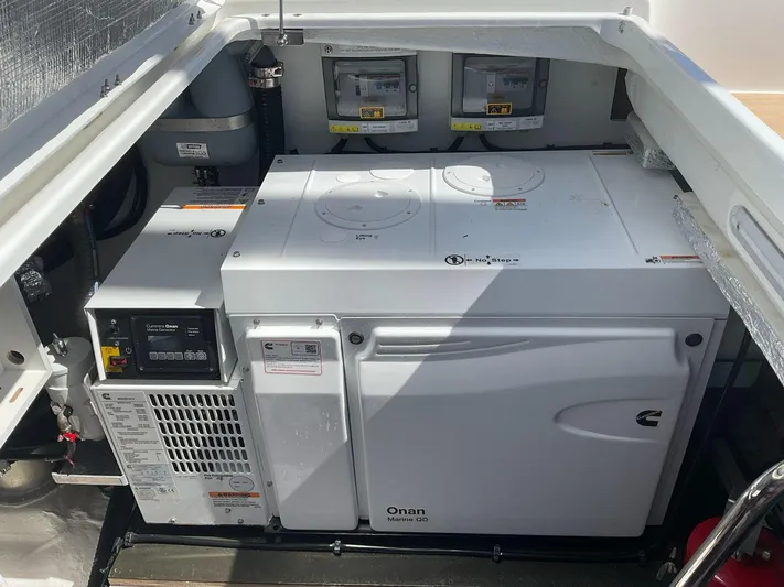 Jdmontt Yacht Photos Pics 2024 Lagoon 55 yacht engine compartment with Onan generator and control panels.