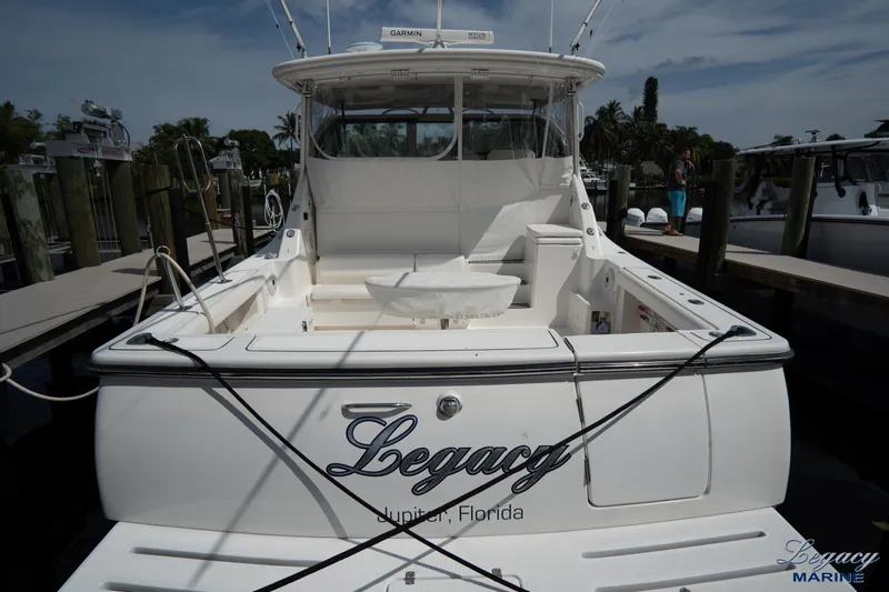 Legacy Yacht Photos Pics 2003 Tiara Yachts 4200 Open docked, rear view with "Legacy" name, in Jupiter, Florida.