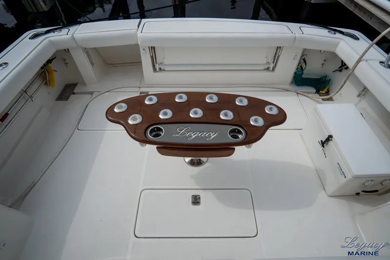 Legacy Yacht Photos Pics 2003 Tiara Yachts 4200 Open cockpit with custom wooden table and seating area.