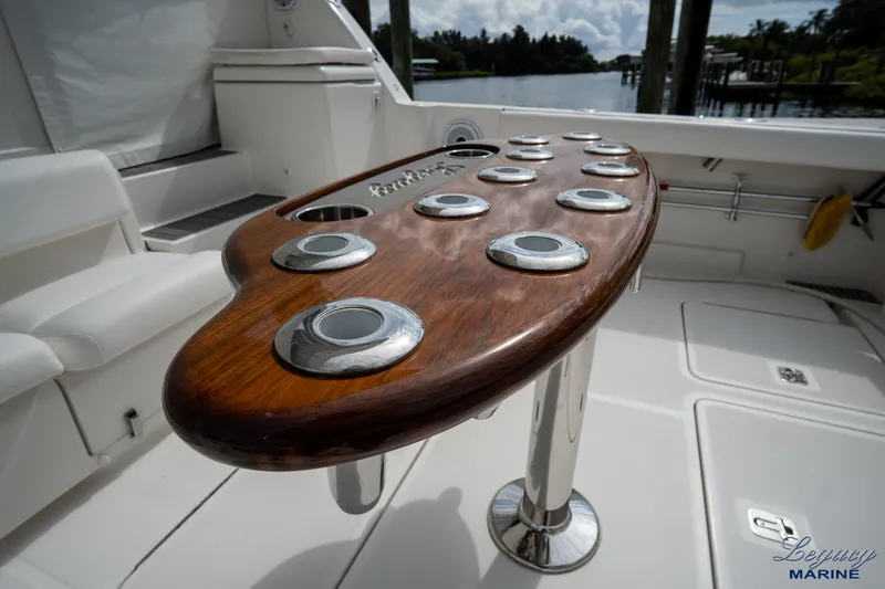 Legacy Yacht Photos Pics 2003 Tiara Yachts 4200 Open cockpit with polished wood table and rod holders.