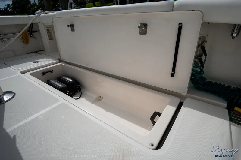 Legacy Yacht Photos Pics 2003 Tiara Yachts 4200 Open storage compartment with equipment inside.