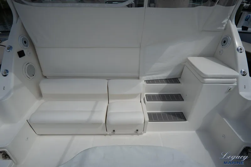 Legacy Yacht Photos Pics 2003 Tiara Yachts 4200 Open interior with white seating and steps.