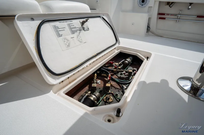 Legacy Yacht Photos Pics 2003 Tiara Yachts 4200 Open engine compartment with open hatch, showcasing internal components.