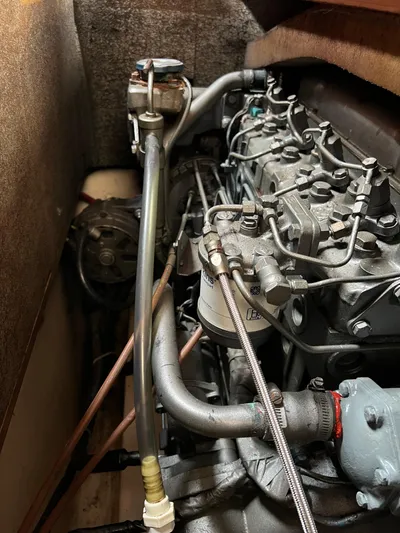 Southern Sky Yacht Photos Pics Engine compartment of a 1991 Beneteau Oceanis 510 sailboat, showcasing mechanical components.