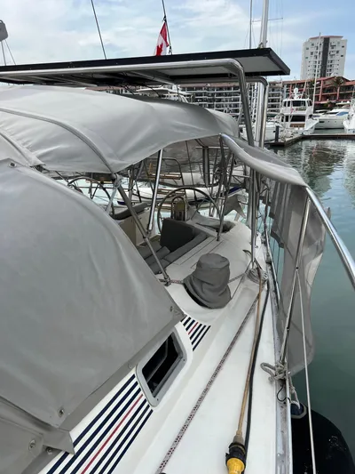 Southern Sky Yacht Photos Pics 1991 Beneteau Oceanis 510 sailboat docked at marina with canopy and modern design.