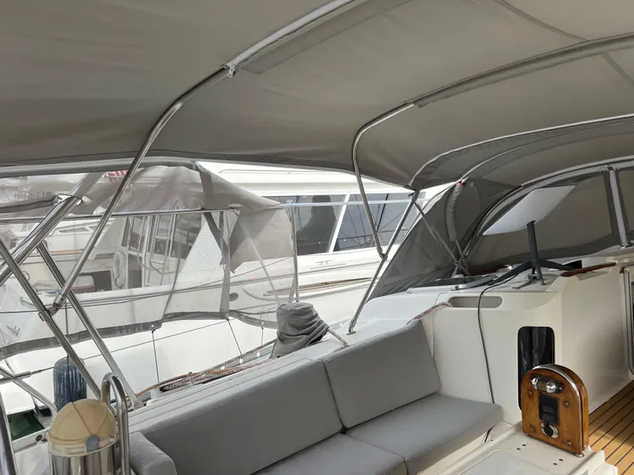 Southern Sky Yacht Photos Pics 1991 Beneteau Oceanis 510 yacht cockpit with canopy and seating area.