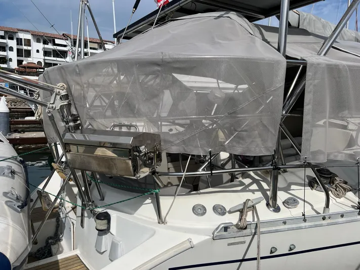 Southern Sky Yacht Photos Pics Beneteau Oceanis 510 sailboat, 1991 model, docked with protective canopy and stainless steel grill.