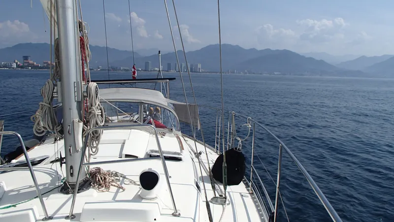 Southern Sky Yacht Photos Pics Sailing on a 1991 Beneteau Oceanis 510 yacht with mountain and city skyline views.