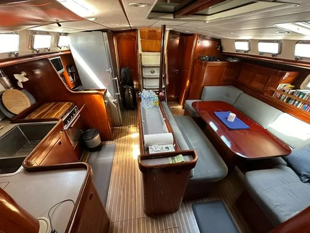 Southern Sky Yacht Photos Pics Interior of 1991 Beneteau Oceanis 510 yacht with wood finish and spacious seating area.