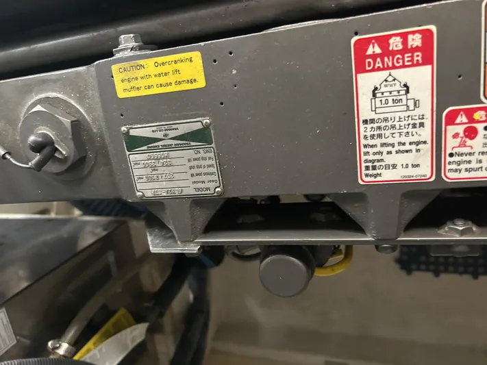 Bay Breeze Yacht Photos Pics Close-up of machinery with caution and danger labels, Sabre 38, 2005 model.