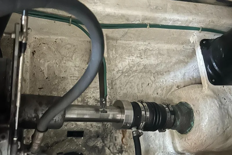 Bay Breeze Yacht Photos Pics Engine compartment of a 2005 Sabre 38 boat, showing mechanical components and hoses.