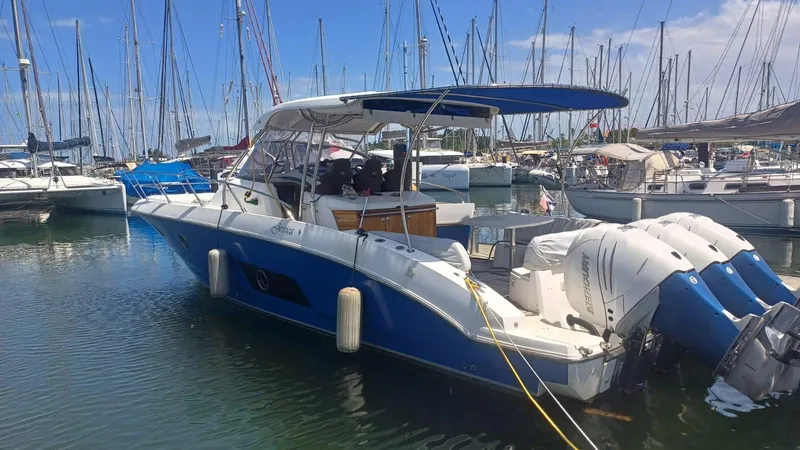 Jessica Yacht Photos Pics 2009 Sessa Marine Key Largo 36 boat docked in a marina with multiple sailboats.