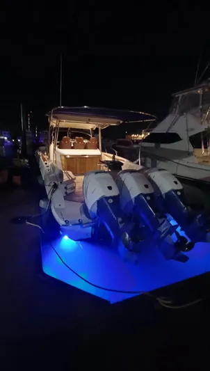 Jessica Yacht Photos Pics 2009 Sessa Marine Key Largo 36 boat with illuminated blue underwater lights at night.