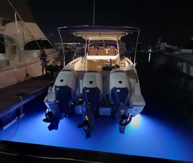 Jessica Yacht Photos Pics 2009 Sessa Marine Key Largo 36 boat with illuminated underwater lights at night.