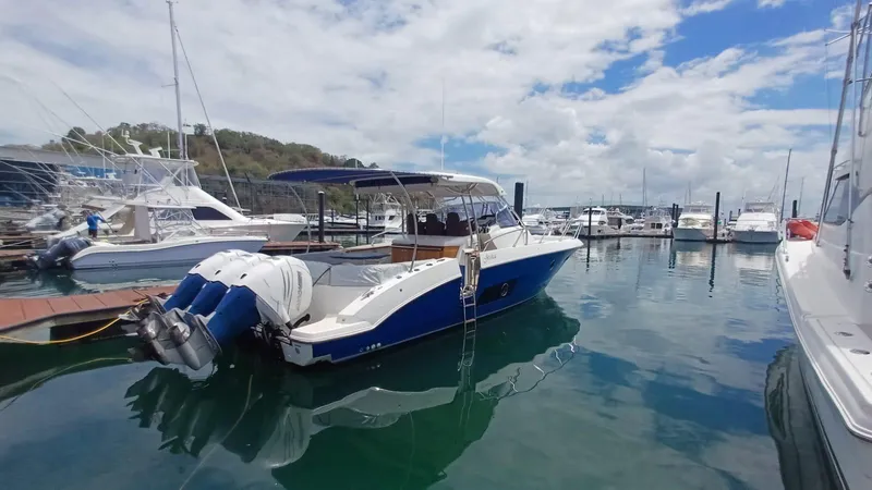 Jessica Yacht Photos Pics 2009 Sessa Marine Key Largo 36 boat docked in a marina under a partly cloudy sky.