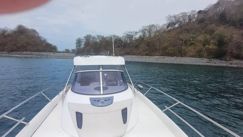 Jessica Yacht Photos Pics 2009 Sessa Marine Key Largo 36 boat approaching a rocky shoreline.