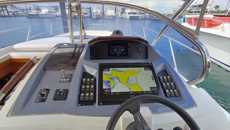 Jessica Yacht Photos Pics Helm of 2009 Sessa Marine Key Largo 36 with navigation display, docked at marina.