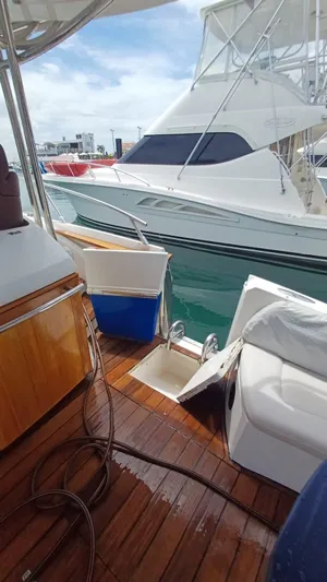 Jessica Yacht Photos Pics 2009 Sessa Marine Key Largo 36 docked, featuring wooden deck and seating area.