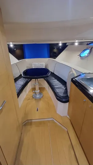 Jessica Yacht Photos Pics Interior of 2009 Sessa Marine Key Largo 36 with seating and kitchenette.