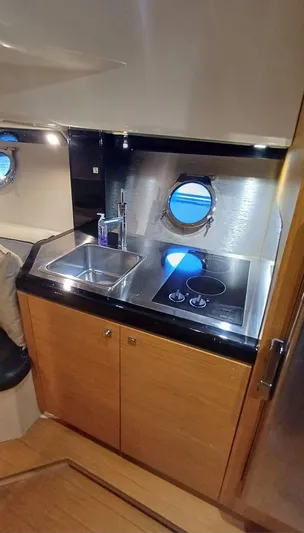 Jessica Yacht Photos Pics 2009 Sessa Marine Key Largo 36 yacht kitchen with sink and stove.