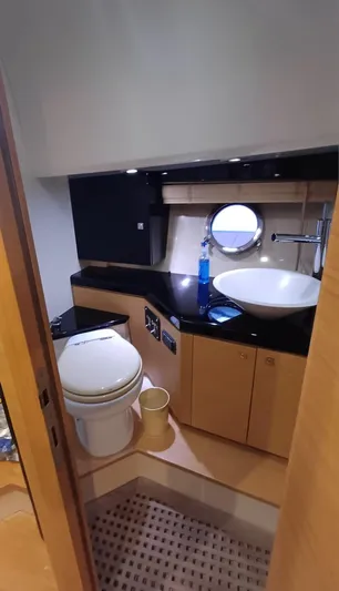 Jessica Yacht Photos Pics 2009 Sessa Marine Key Largo 36 yacht bathroom with modern fixtures and porthole window.