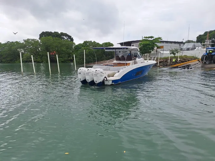 Jessica Yacht Photos Pics 2009 Sessa Marine Key Largo 36 boat docked near lush greenery and calm waters.